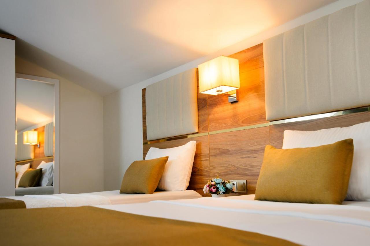 Dreibettzimmer mit Terrasse und Meerblick